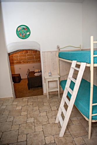 Ένα ή περισσότερα κρεβάτια σε δωμάτιο στο Vacanze al San Domenico