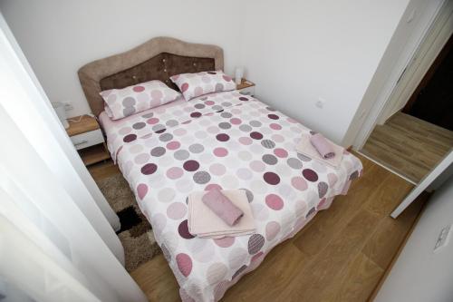 Postel nebo postele na pokoji v ubytování Apartman Minja