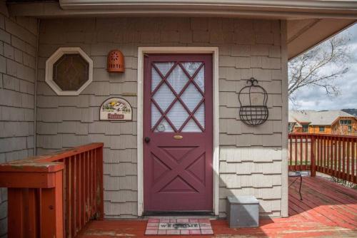 a purple door on the side of a house at Sundance Suite, 1 Bedroom with fireplace Dogs OK in Estes Park