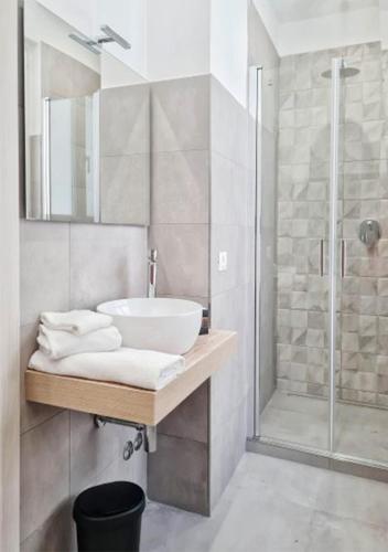 a bathroom with a sink and a shower at RossHouse in Sorrento
