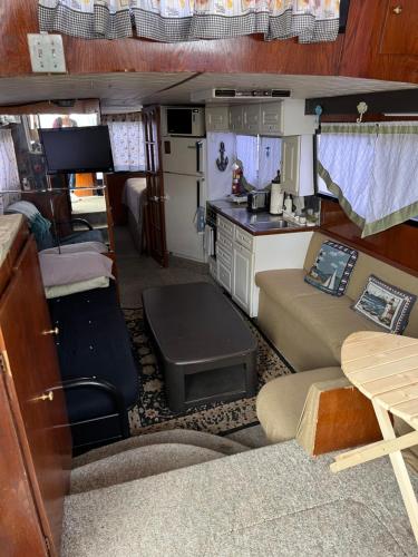 a living room and kitchen in an rv at Hills Motel & Marina in Alexandria Bay