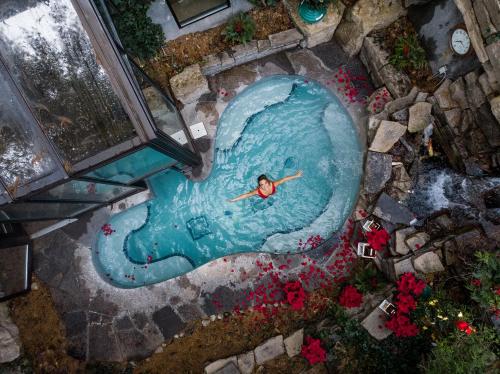 an overhead view of a person in a swimming pool at Pillar and Post Inn & Spa in Niagara on the Lake