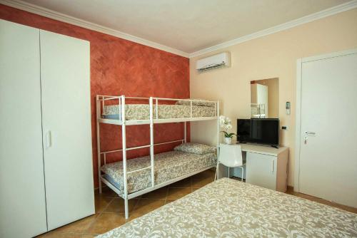 Postel nebo postele na pokoji v ubytování B&B Carmelina