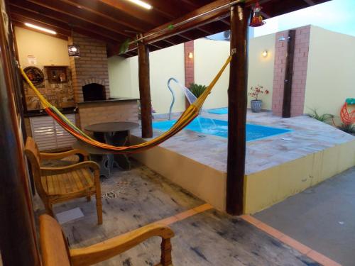 Ένα ή περισσότερα κρεβάτια σε δωμάτιο στο Loft Paraíso com piscina privativa em Brotas SP