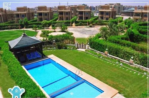 an image of a swimming pool in a yard at Chalet in Bluebay Asia Resort Ain Sokhna in Ain Sokhna