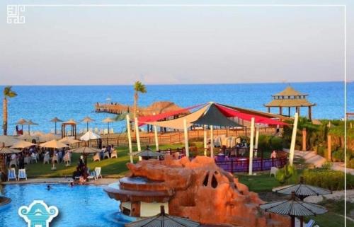 a resort with a water park and the ocean at Chalet in Bluebay Asia Resort Ain Sokhna in Ain Sokhna