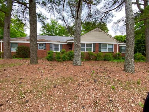 a house with trees in front of it at Charming Condo Near Downtown, NCSU and PNC Arena in Raleigh