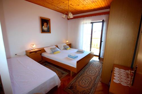 Postel nebo postele na pokoji v ubytování Apartment Djurdjica