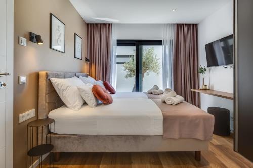 Ένα ή περισσότερα κρεβάτια σε δωμάτιο στο Villa Atrio