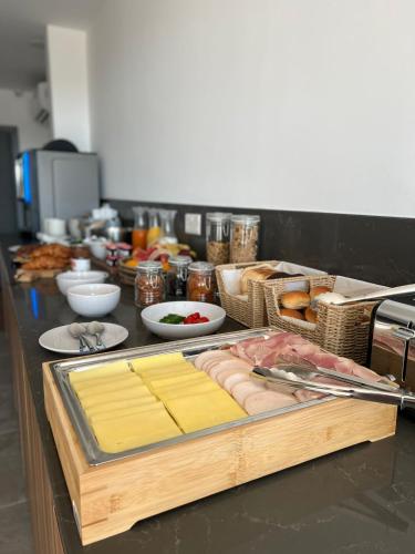 a kitchen counter with some food on a table at City Stay B&B in Taʼ l-Imgħajjen