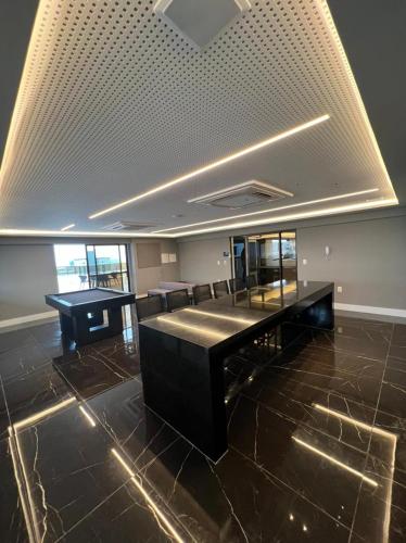 a large room with a table and chairs in it at Mardisa Design by Jess Hospedagens in João Pessoa