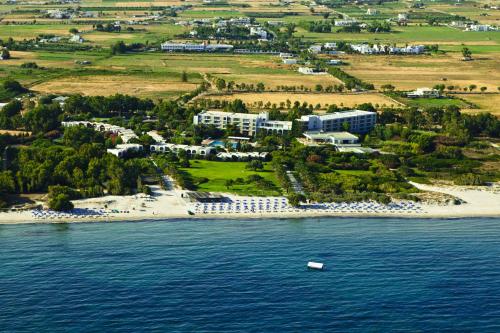 an aerial view of a small island in the water at Caravia Beach Hotel in Marmari