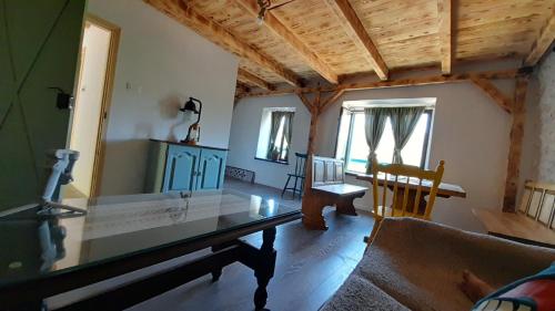 a living room with a table and a couch at Old Lato's House in Danilovgrad