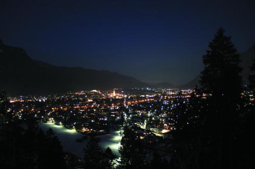 a view of a city at night at Riessersee Hotel in Garmisch-Partenkirchen