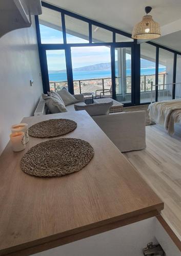 a room with a large table with three large rugs on it at Fİ SALDA in Doğanbaba