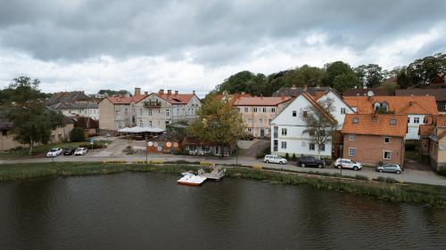 a small boat in a river in a town at Apartaments Nr. 33 ( Viesu Nr. 4) in Talsi