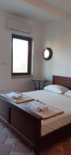 Ένα ή περισσότερα κρεβάτια σε δωμάτιο στο Ilic Apartmani