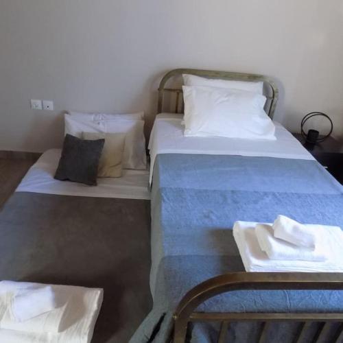 Postel nebo postele na pokoji v ubytování Nikos House Megara