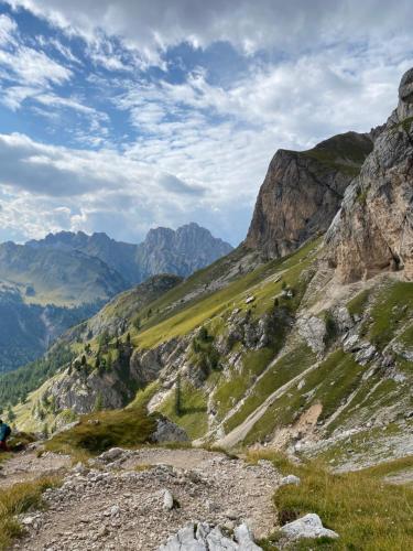 a view of a mountain valley with mountains in the background at Casa Fiemme Panchià in Panchia