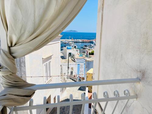 a window with a view of a city at La Palladiana - Immobilevante in Ponza