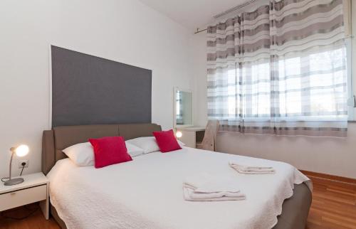 Posteľ alebo postele v izbe v ubytovaní Apartman Pegla
