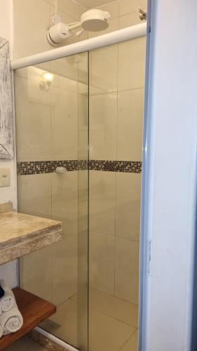 a shower with a glass door in a bathroom at Top de Buzios Boutique Hotel & Spa in Búzios