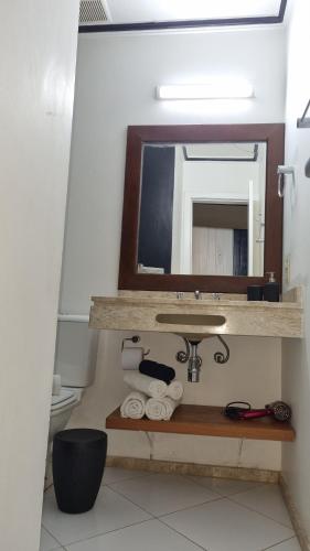 a bathroom with a sink and a mirror at Top de Buzios Boutique Hotel & Spa in Búzios