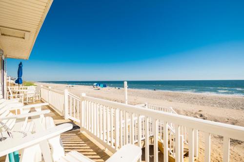a view of the beach from the deck of a beach house at Lisa Lu by Oak Island Accommodations in Oak Island