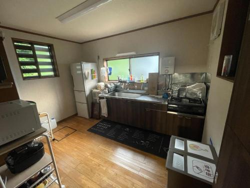 a kitchen with a counter and a refrigerator at Jonobien - Vacation STAY 13238 in Minami Uonuma