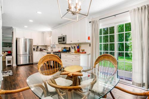 a kitchen with a glass table and chairs at 96097 Piney Island in Fernandina Beach
