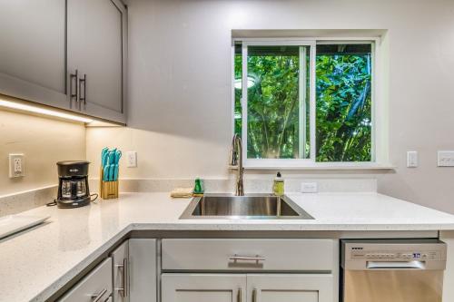 a kitchen with a sink and a window at Pearl Street Studio in Eugene