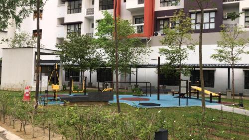 an empty playground in front of a building at Roomstay in Putrajaya (Female only/Queen bed) in Kampong Batu Sembilan