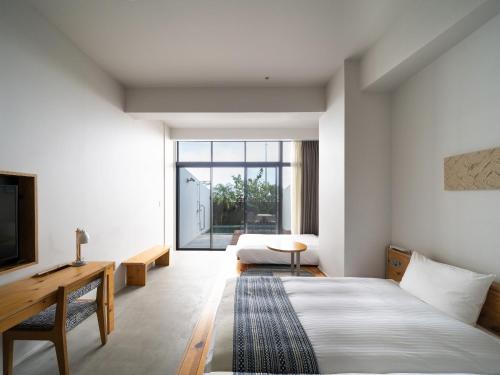 Postel nebo postele na pokoji v ubytování Hotel Locus