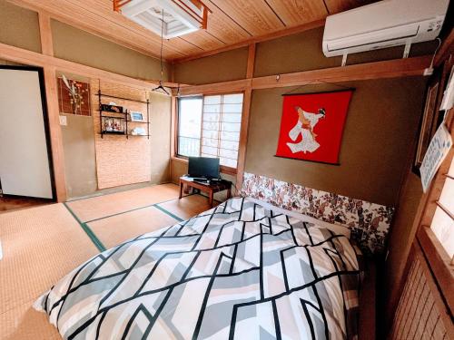 Cama o camas de una habitación en Asahi
