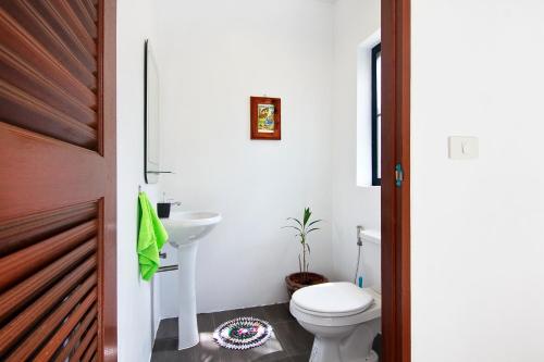 a bathroom with a toilet and a sink at 2 Bays Villa in Thong Nai Pan Yai