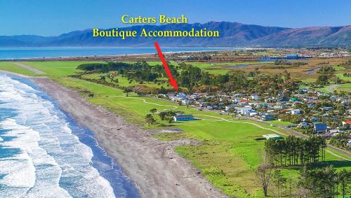 an aerial view of the shoreline of a beach at Carters Beach Seaside Accommodation in Carters Beach