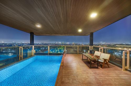 a swimming pool on the roof of a building at Aston Inn Jemursari in Surabaya