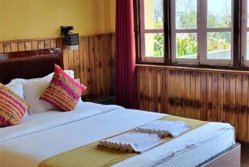 Voodi või voodid majutusasutuse Pelling Hotel Ladakh House toas