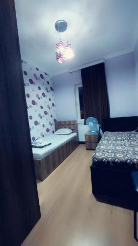 a room with two beds and a room with at Guesthouse different in Tbilisi City