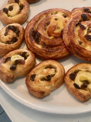a white plate of pastries on a table at Hotel Adelphi in Riccione