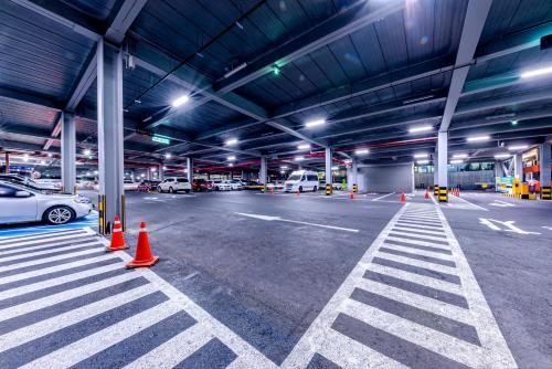 an empty parking garage with cars parked in it at Trevi Hotel in Jeju