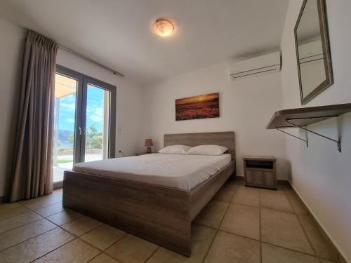 Postel nebo postele na pokoji v ubytování Seastone Villas