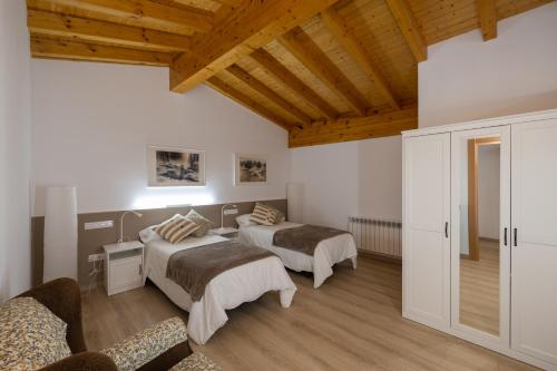 Posteľ alebo postele v izbe v ubytovaní Vivienda La Laguna