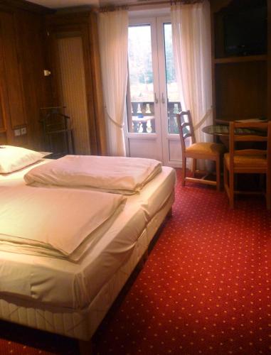 Katil atau katil-katil dalam bilik di Logis Hôtel-Restaurant Auberge d'Imsthal