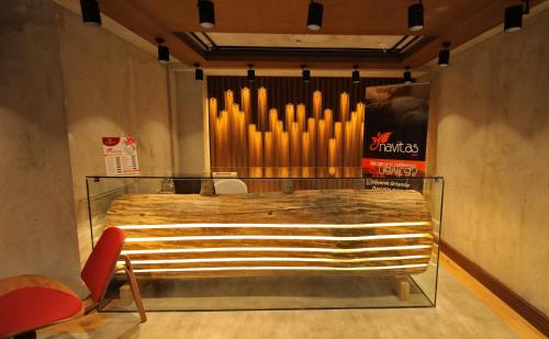 a large bed in a room with a large organ at Abant Kosk Oteli in Abant