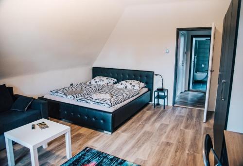 Postel nebo postele na pokoji v ubytování Apartmány Rajschl - Železná Ruda