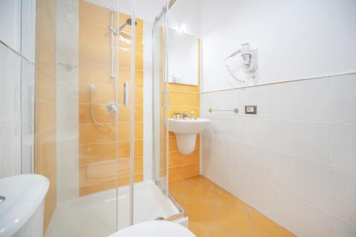a bathroom with a shower and a toilet and a sink at La Casa del Pozzo Vecchio in Procida