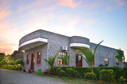 a brick house with a dome on top of it at The Fateh Pratap Hotel & Resort in Sheoganj