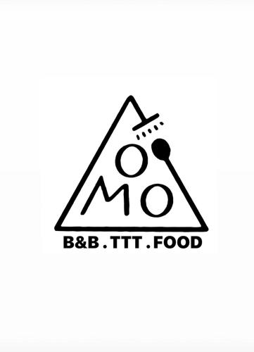 a logo for a fast food restaurant with a triangle sign at TOMO B&B in Taitung City