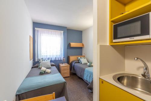 Posteľ alebo postele v izbe v ubytovaní Residencia Universitaria Resa La Ciutadella